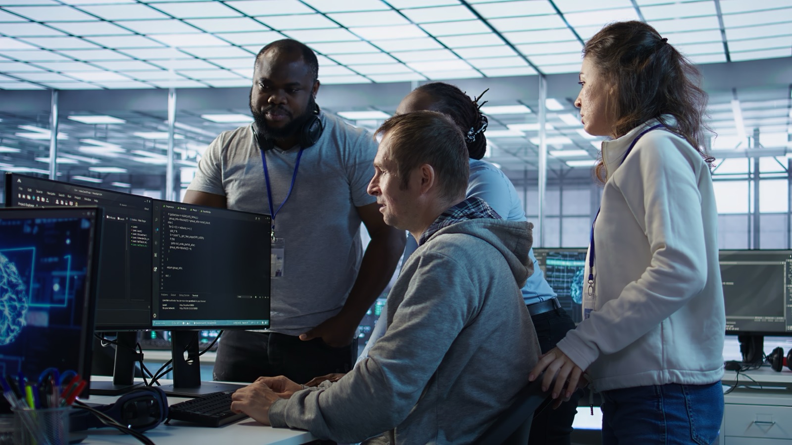 HiyaMee Digital AI engineers reviewing live data on screen in an operations centre