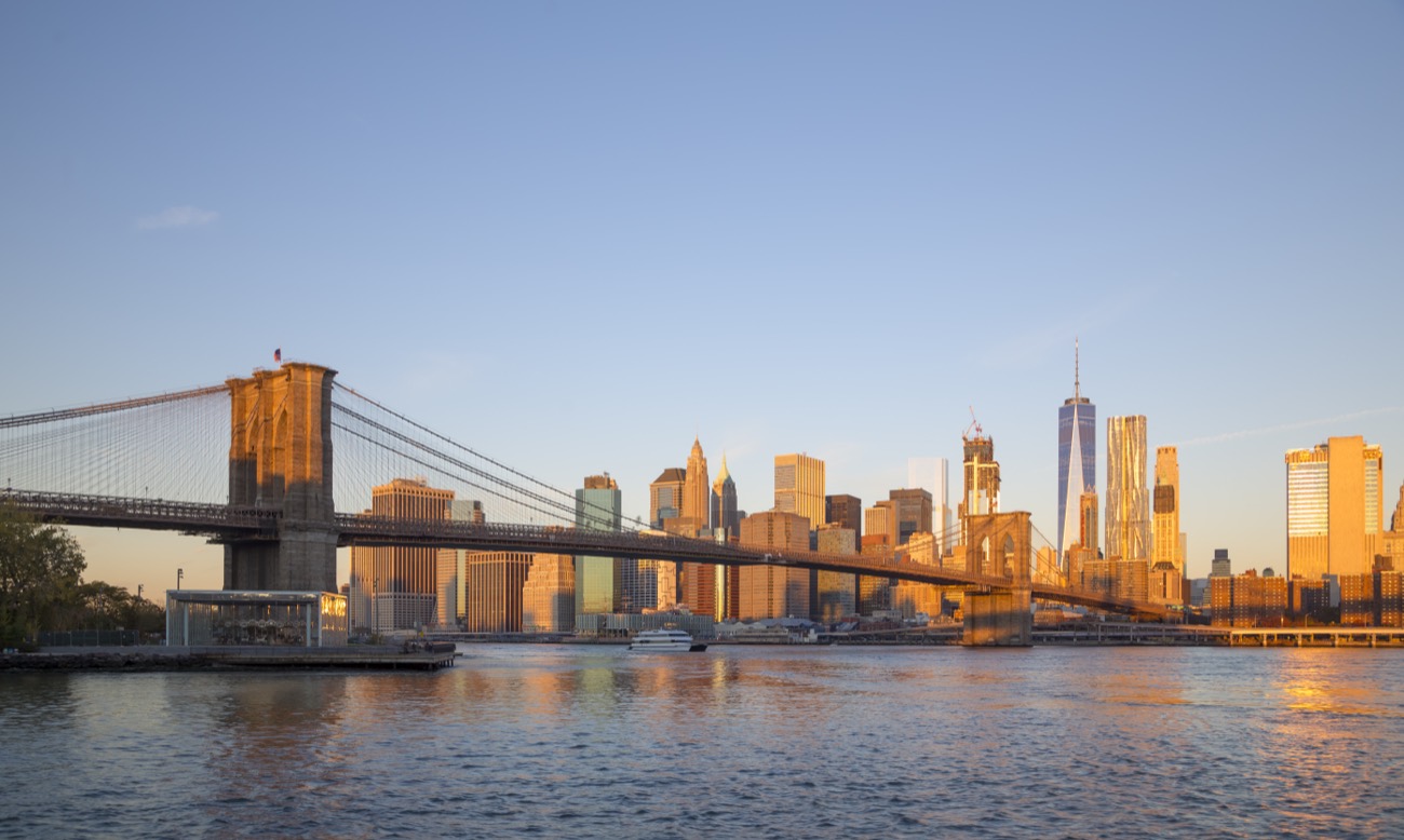 Lower Manhattan skyline and the Brooklyn Bridge at golden hour