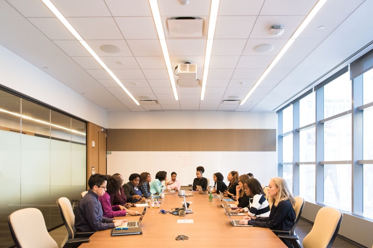 A diverse leadership team meeting in a boardroom